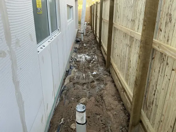 Drainage and site water management — defect found during enclosed/waterproofing inspection in Brisbane
