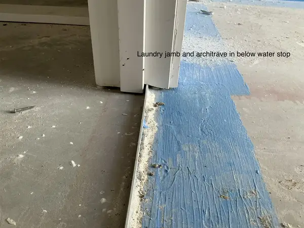 Laundry jamb below water stop — defect found during enclosed/waterproofing inspection in Brisbane