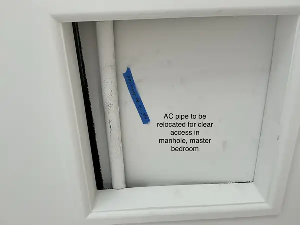 AC pipe blocking manhole access