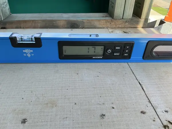 Digital level showing 17mm deviation
