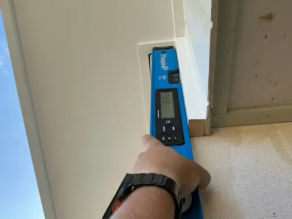 Bulkhead defect found during PCI inspection — Brisbane new home, identified using digital level — VG Inspect