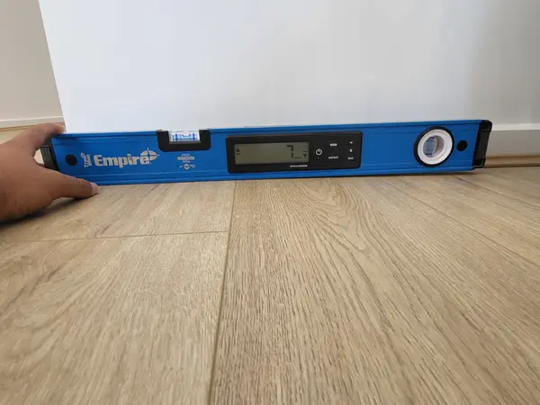 Floor level measurement showing 7mm variance - NCC 2022 tolerance check