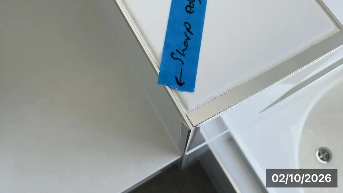 Sharp cut tile edge left exposed
